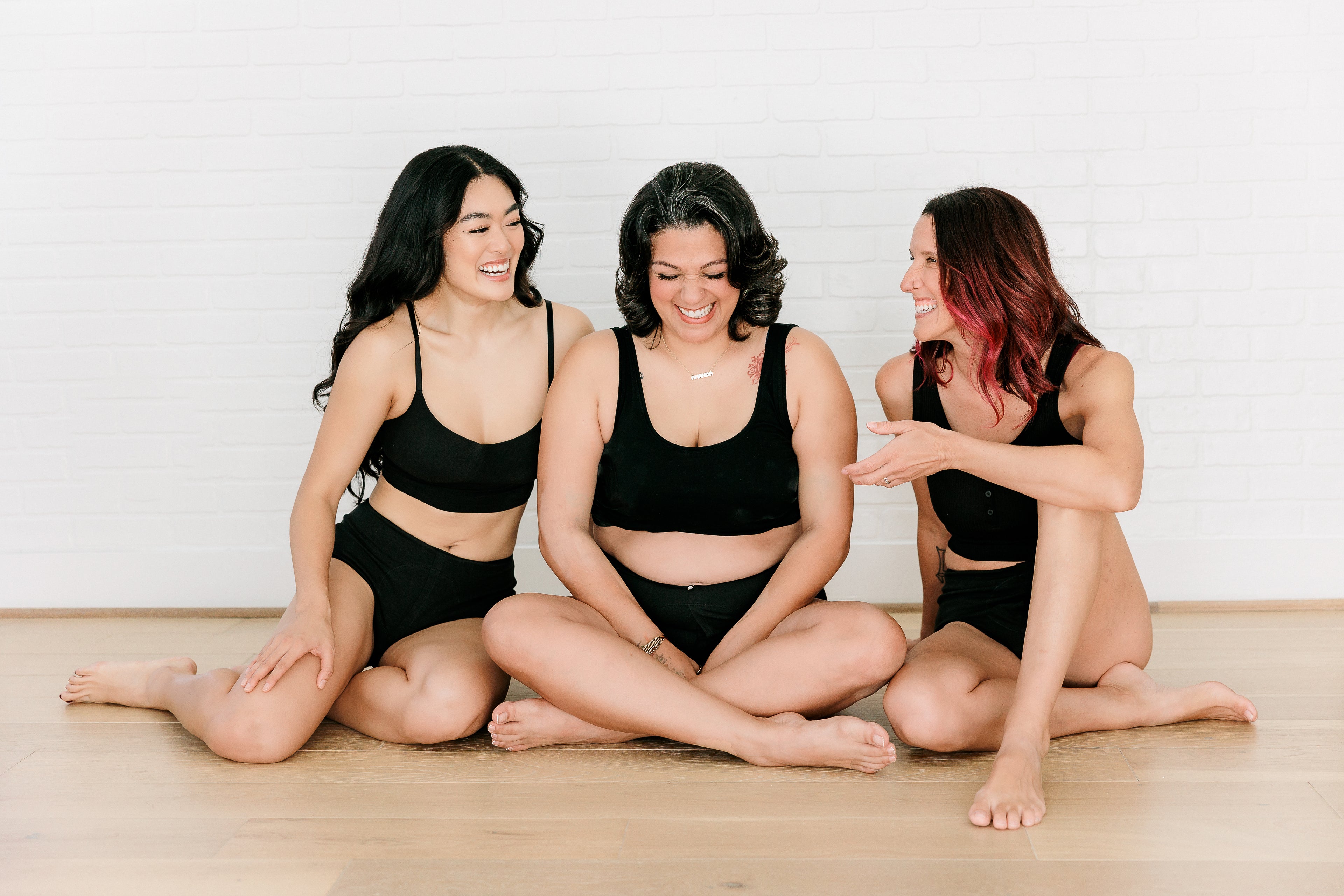 Three women wearing Fri Period underwear