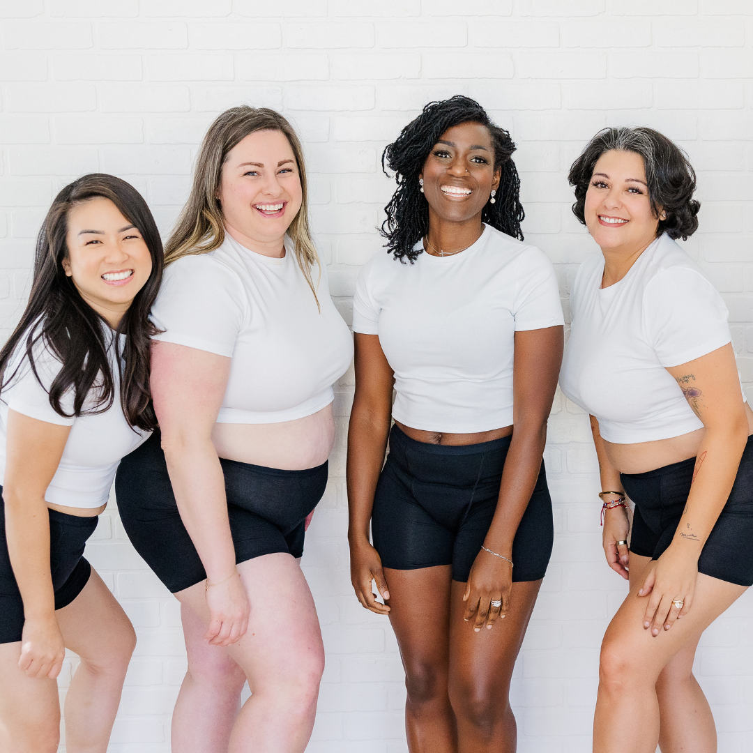 Four women wearing Fri Period Period Boxers. They are all smiling and look relaxed and happy.
