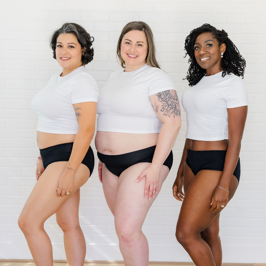 Three women wearing Fri PEriod underwear and white tshirts