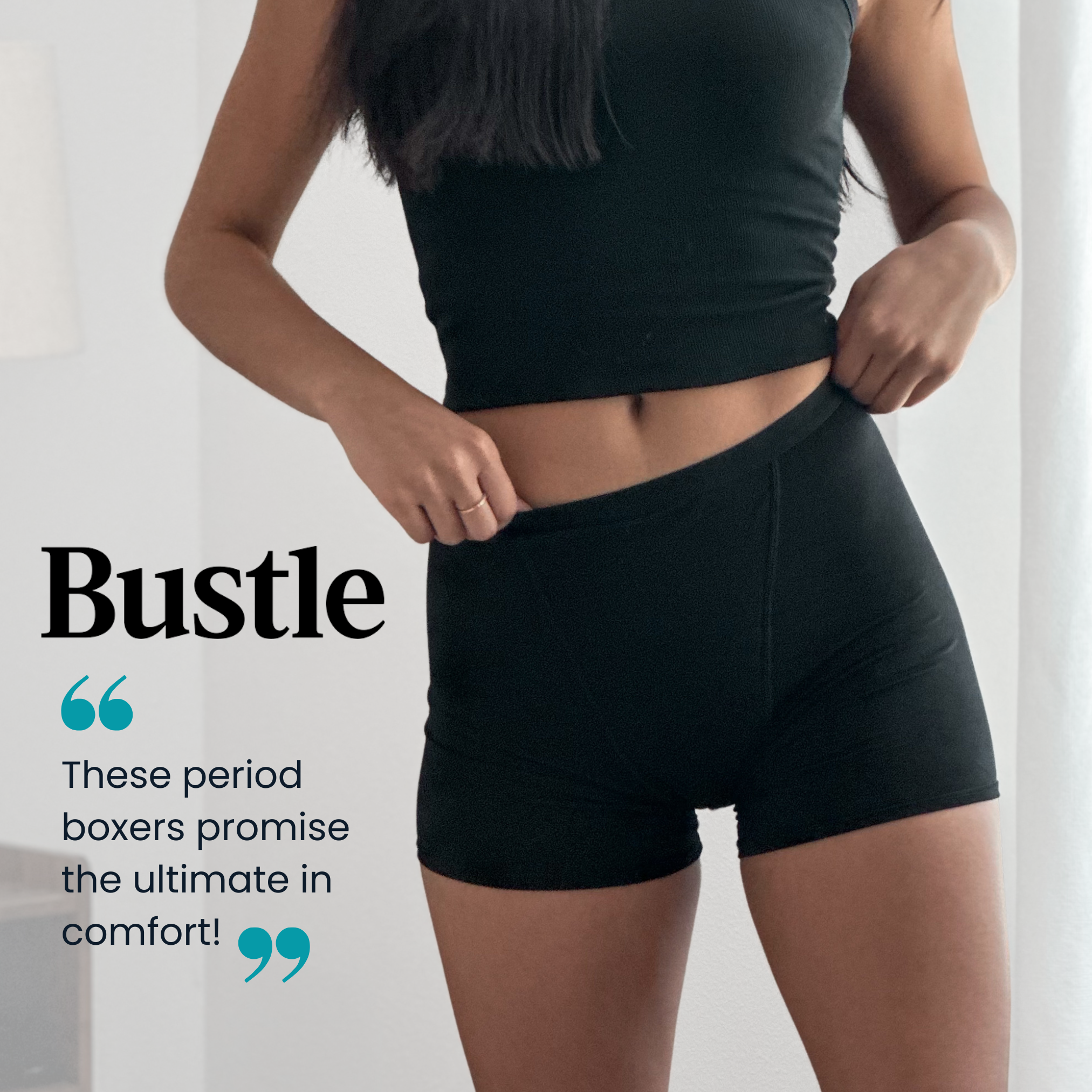 Person wearing black period boxers with 'Bustle' branding and text about comfort.
