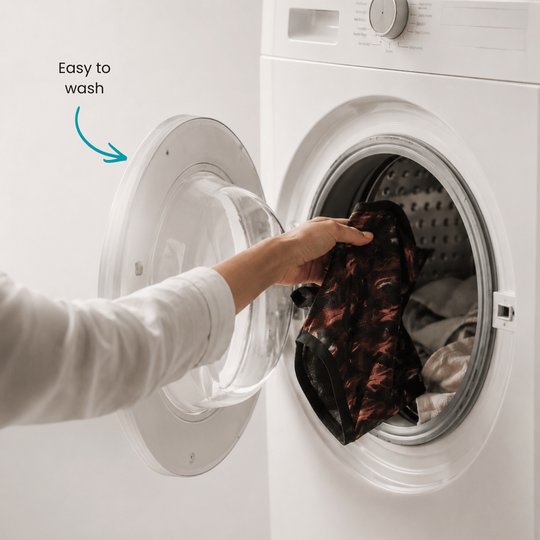 Person placing a garment into a washing machine with text 'Easy to wash' and an arrow pointing to the open door.