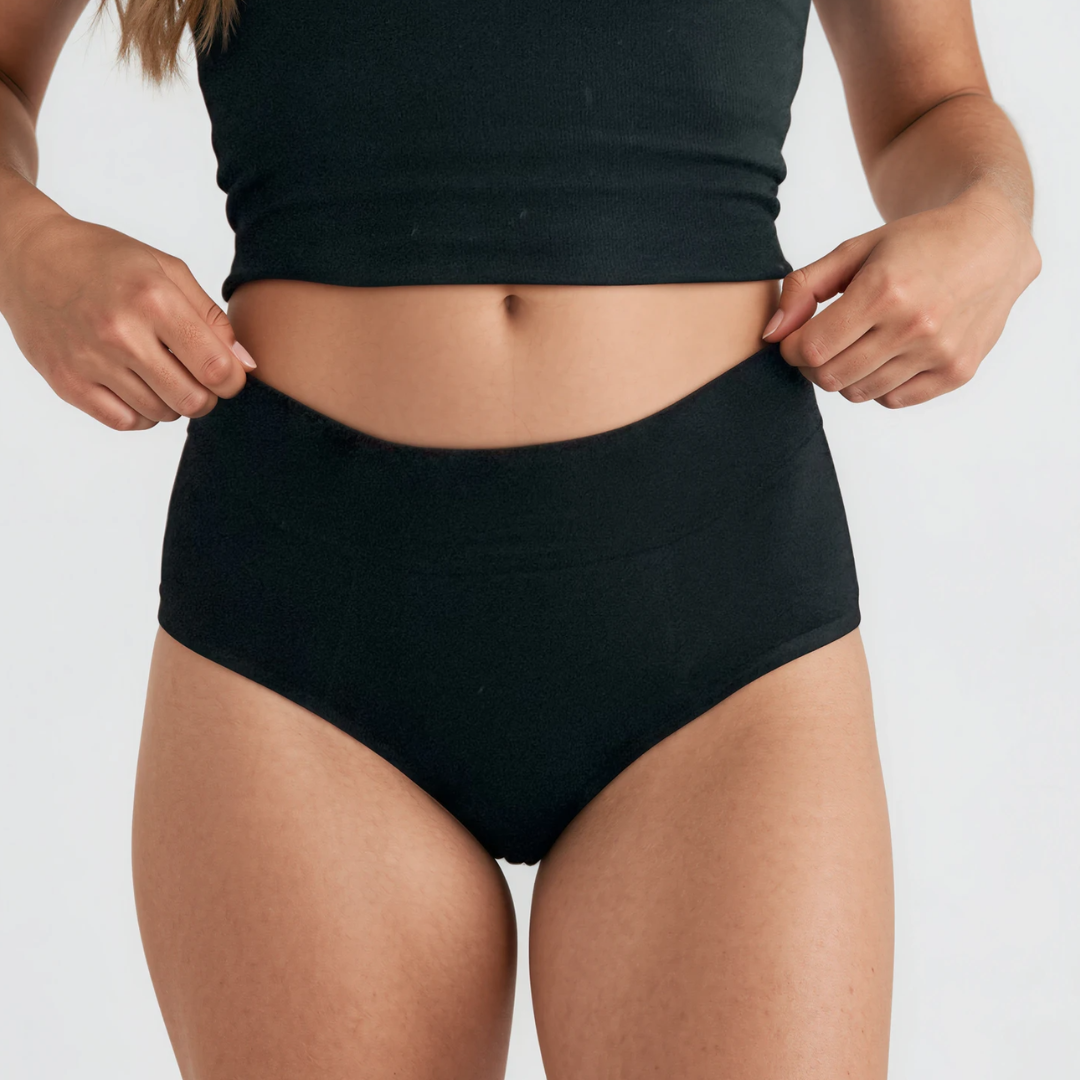 Woman wearing fri Period classic period briefs against a light grey background