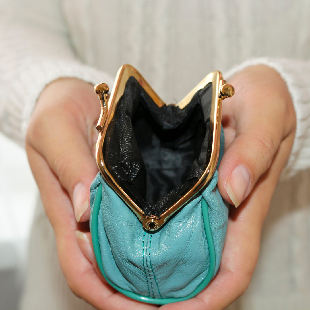 Woman's hands holding empty wallet